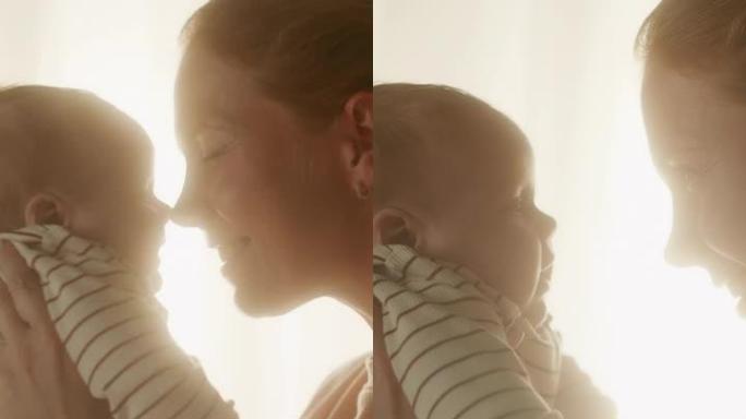 晚上，快乐母亲在舒适的黑暗儿童卧室里抱着可爱的新生婴儿的垂直格式肖像视频。有爱心的妈妈拥抱着新生的小