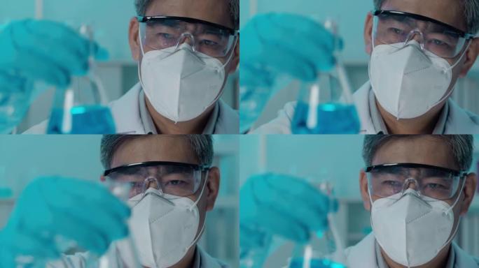 54岁的亚洲科学家在实验室生物学家进行Covid-19疫苗冠状病毒试验。科学实验室的概念。