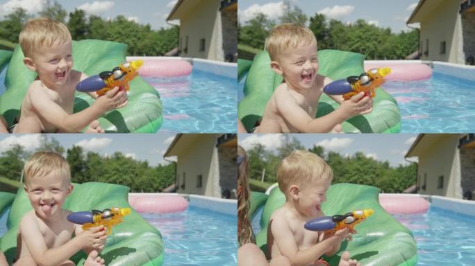 特写小男孩在游泳池里漂浮时享受水上战斗游戏