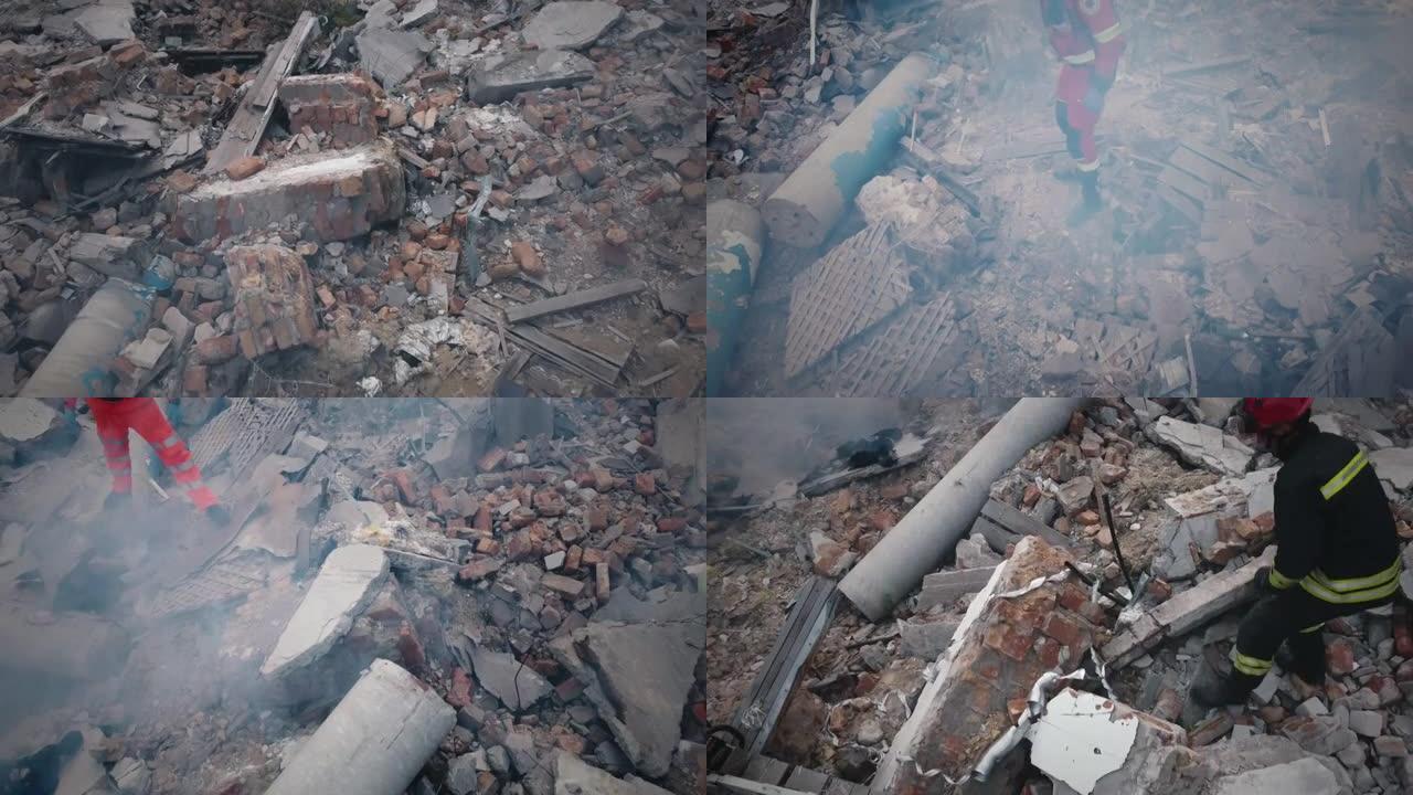 被摧毁的建筑物废墟上的医护人员和救援人员