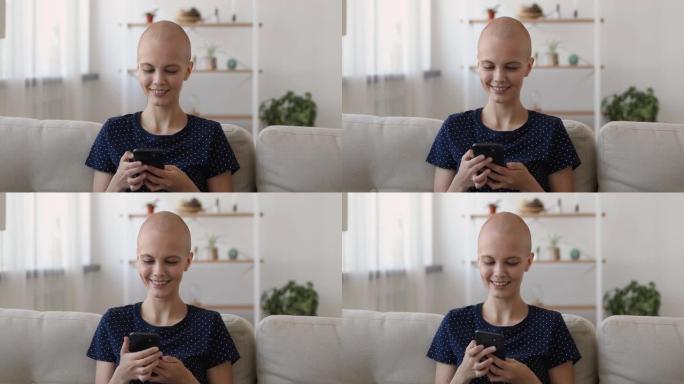 快乐真诚的秃头女人使用智能手机应用程序。