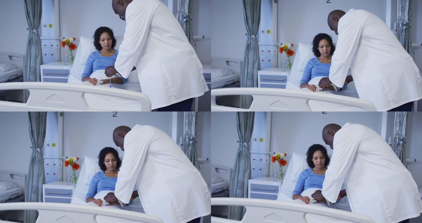 多元化的男医生在病房里给女性病人打点滴