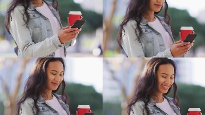 亚洲妇女使用智能手机并拿着外卖咖啡