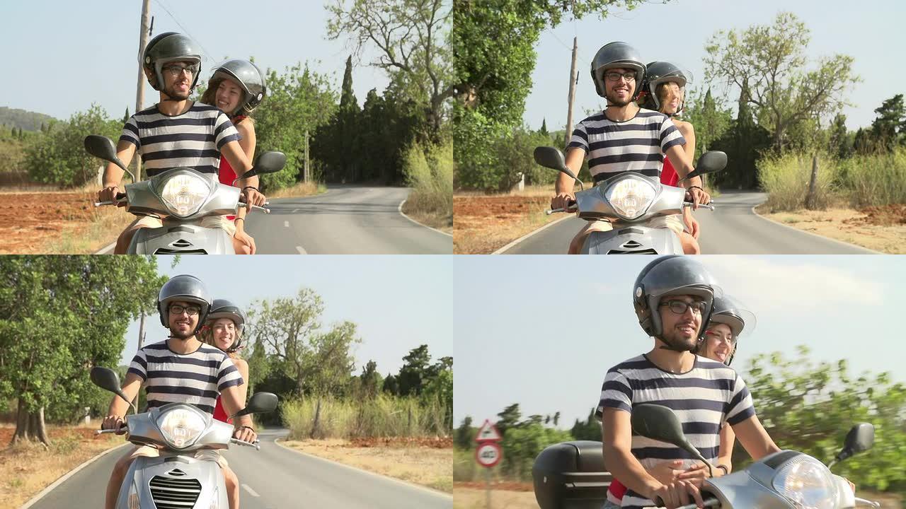 情侣在公路上骑摩托车的慢动作镜头