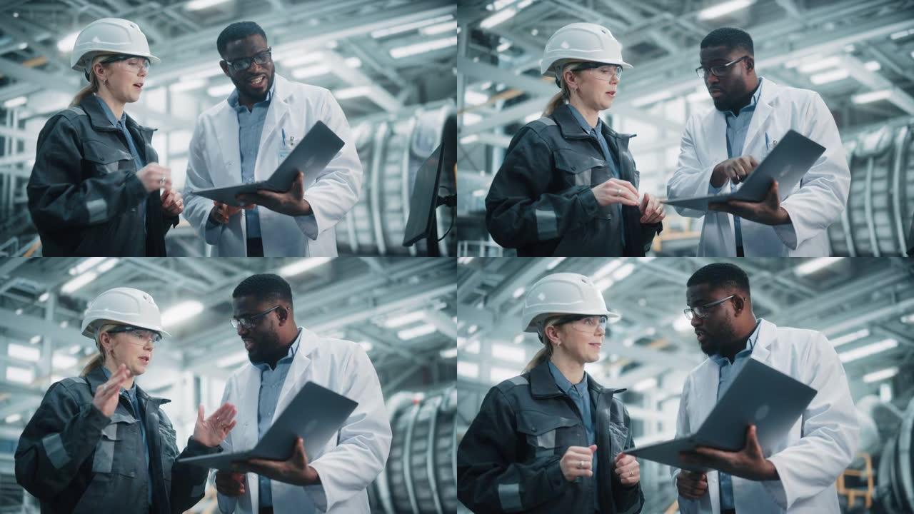 由各种专业的重工业工程师组成的团队，他们穿着安全制服和安全帽在笔记本电脑上工作。非裔美国技术人员和女