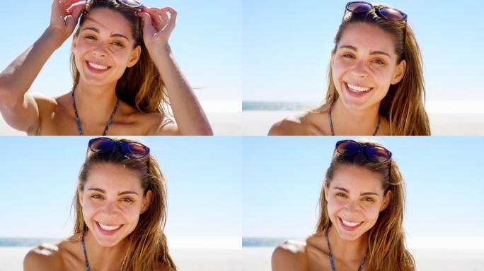 4k视频片段，一个美丽的年轻女子在海滩上度过时光