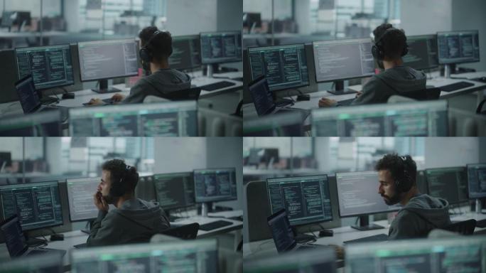 办公室: 专业的白色IT程序员在台式电脑上工作时使用耳机。男性网站开发者，软件工程师开发应用程序，视