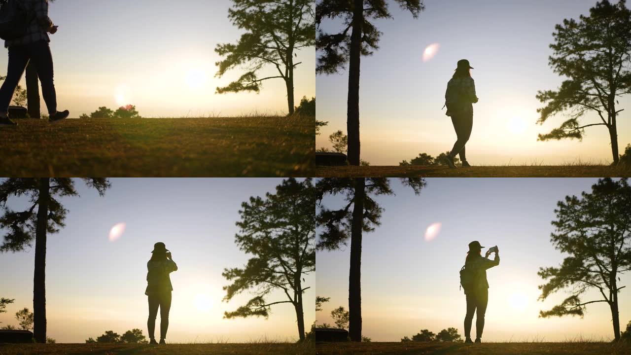 女旅行者在山上拍一张日落的好地方