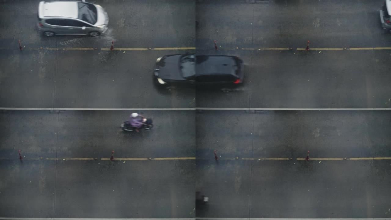 城市交通鸟瞰图，地面车辆在雨中行驶
