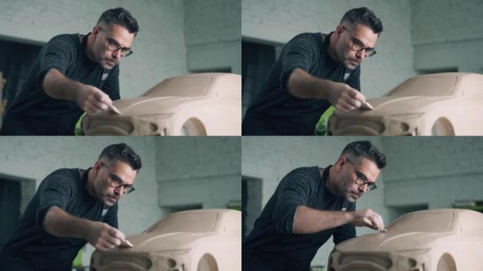 汽车设计师拖着木制雕刻工具雕刻设计细节