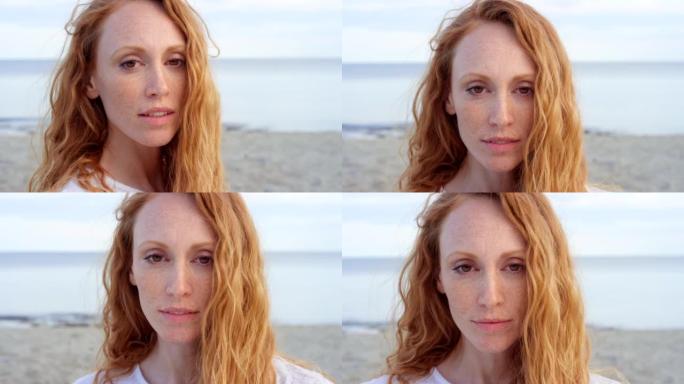 一个美丽的年轻女子在海滩上度过的4k视频片段