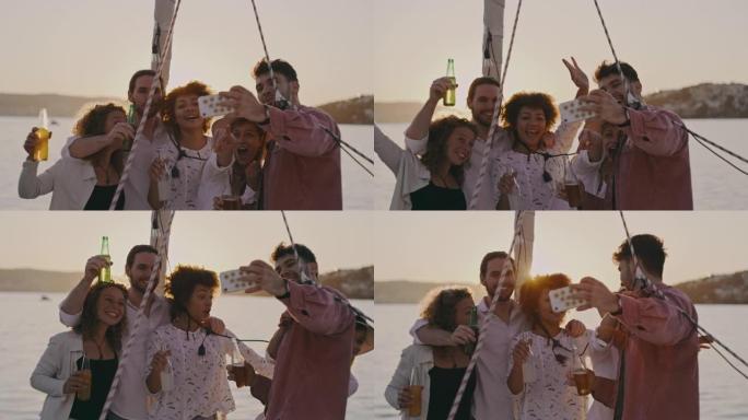 SLO MO一群朋友在日落时在船的甲板上自拍