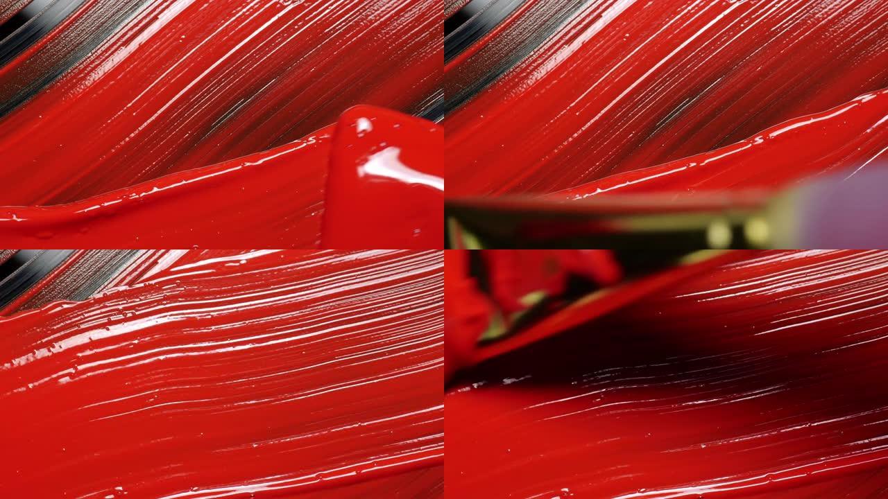 刷子混合红色丙烯酸画。