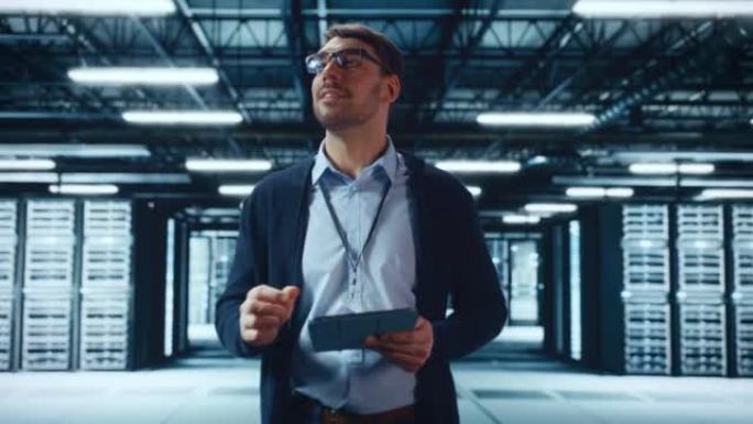 男性IT专家在数据中心的一排操作服务器机架之间行走。工程师使用平板电脑进行维护。云计算、人工智能、网