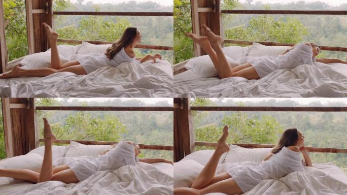 迷人的女人躺在酒店度假胜地的床上，享受享受热带丛林舒适放松的假期