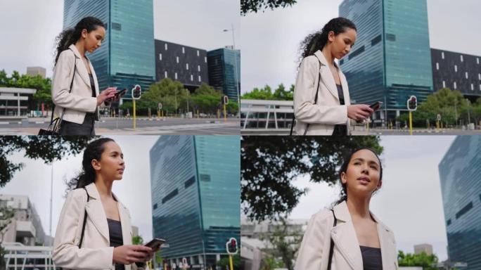 一名年轻的女商人从下面在城市里等出租车时用手机发短信。雄心勃勃的企业家在早上上班时浏览应用程序和社交