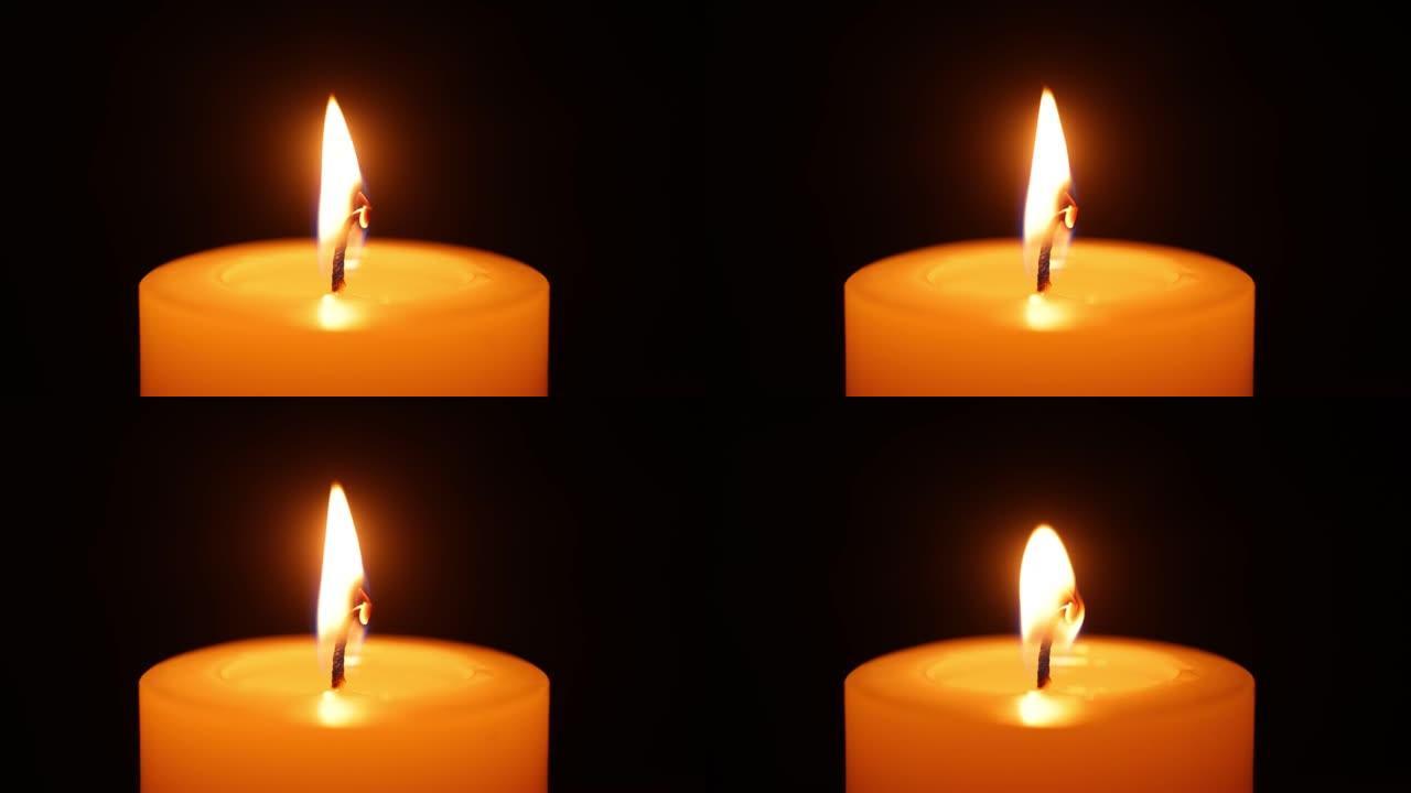 燃烧的蜡烛蜡烛特写火焰特写祈祷
