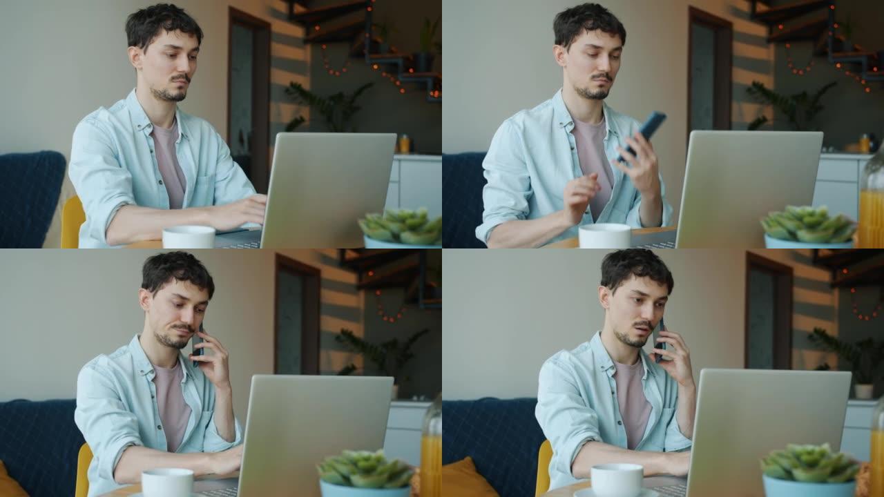 成功的自由职业者在手机上讲话并在家中使用笔记本电脑的肖像