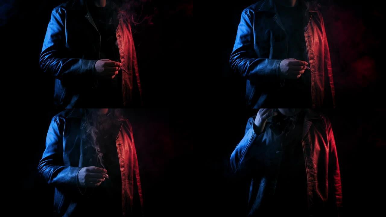 男人在霓虹红色和蓝色辉光中抽烟