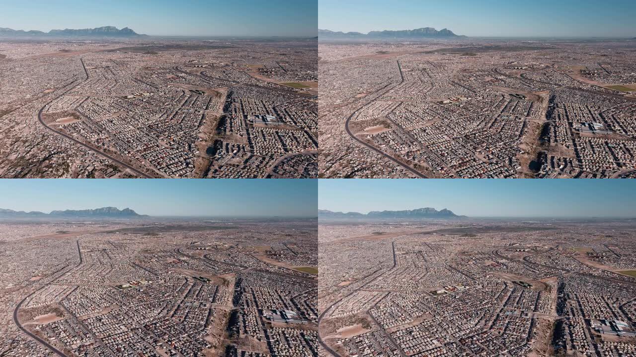 贫穷。不平等。在南非开普敦的Cape Flats上，人口稠密的Khayelitsha镇的高空飞行