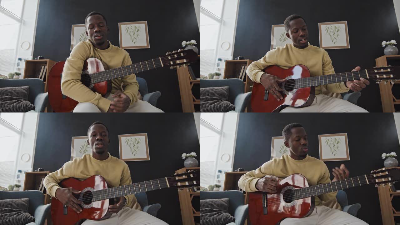 黑人在相机上弹吉他