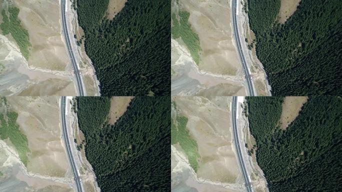 森林与山脉之间的新疆公路俯视图