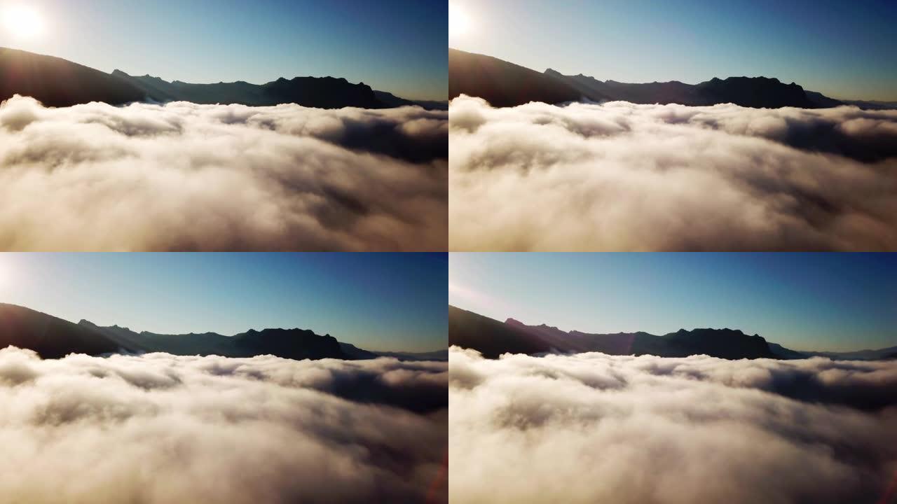 云雾和山底上有日出的移动雾