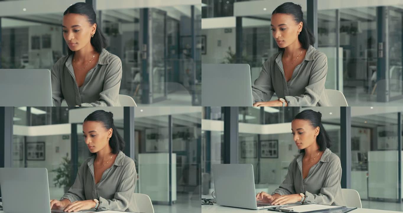 4k视频片段，一位迷人的年轻女商人独自坐在办公室里并使用笔记本电脑