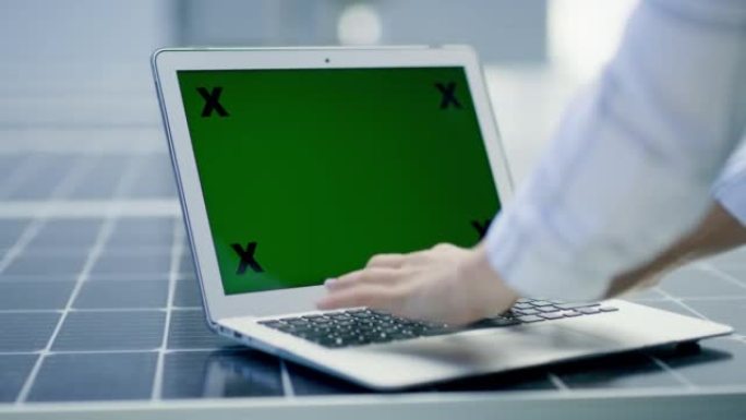 绿色屏幕，chromakey和笔记本电脑屏幕上带有跟踪标记的复制空间，用于广告或营销。产品展示和数字