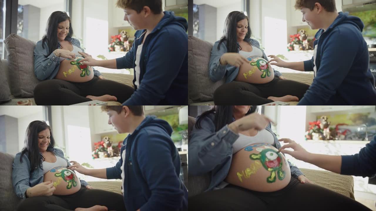 WS十几岁的儿子在母亲怀孕的肚子上手指画