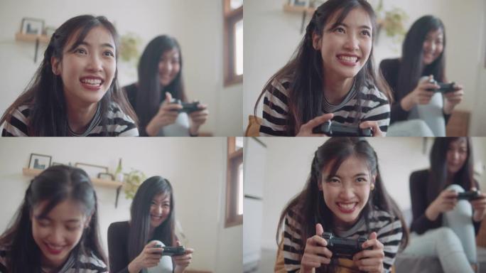 亚洲朋友在家里一起玩电子游戏。