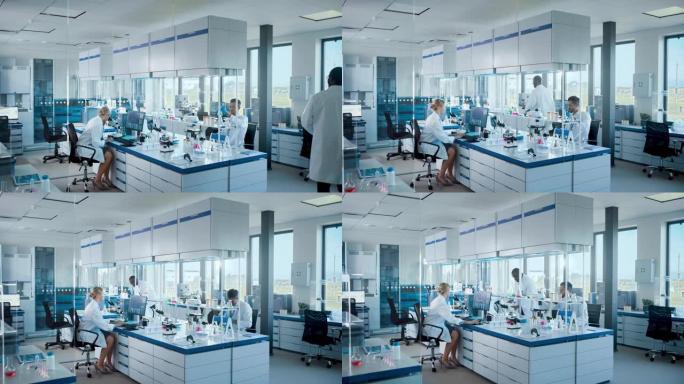 明亮的高科技医学科学实验室，由不同的专业研究科学家团队与显微镜，计算机合作。用现代设备开发药物、疫苗