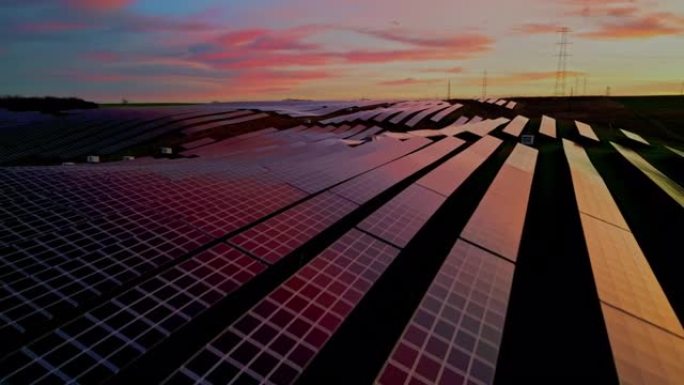 无人机的观点日落反射在农村太阳能农场的太阳能电池板上