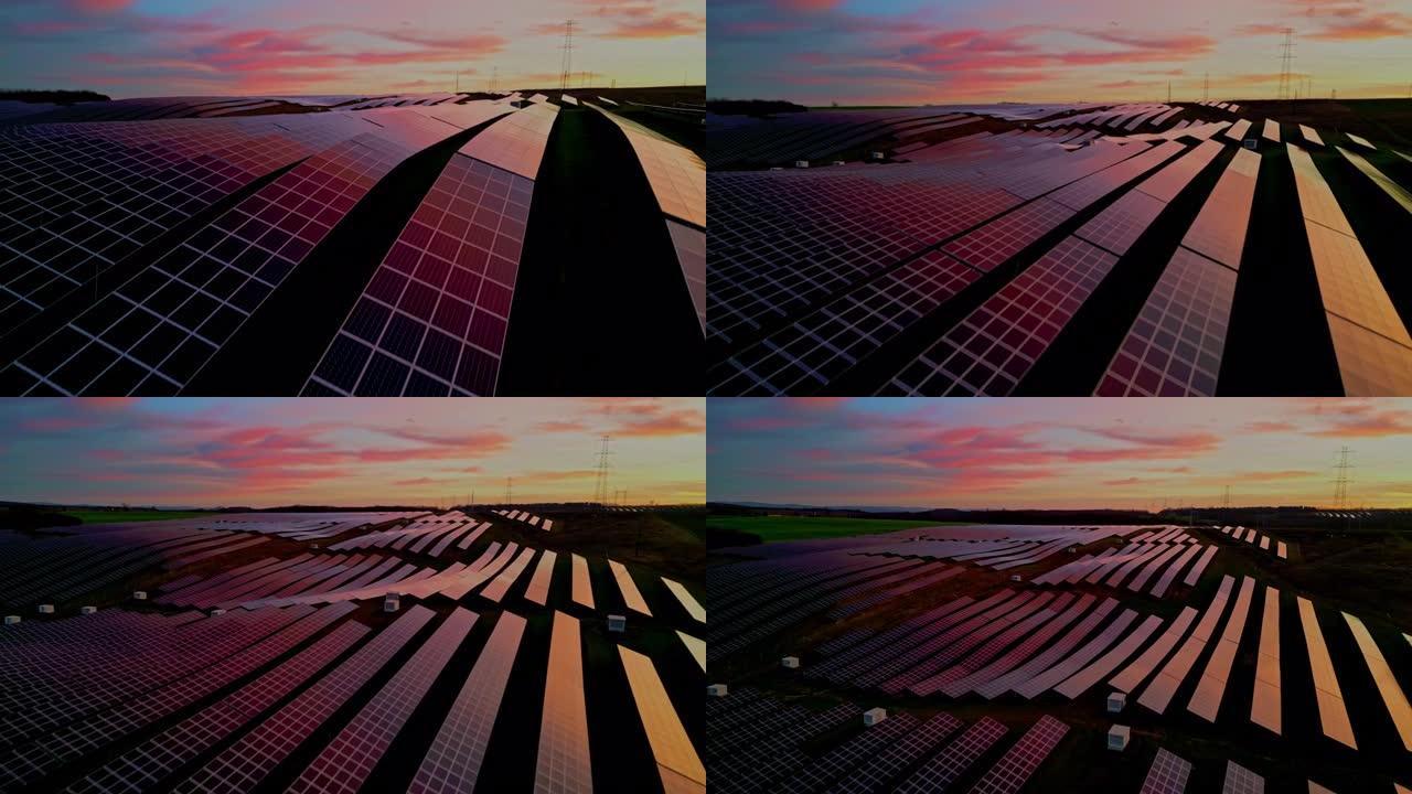 无人机的观点日落反射在农村太阳能农场的太阳能电池板上
