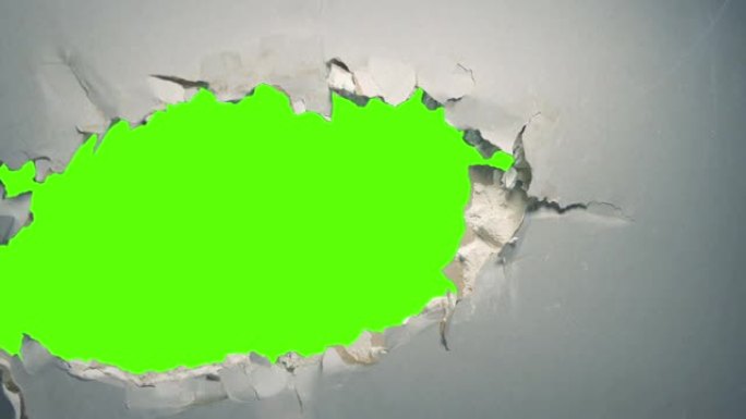 墙壁绿屏切口上的大洞