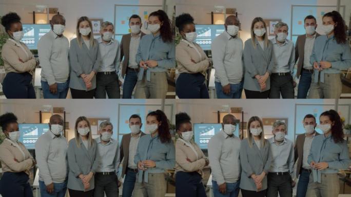 新型冠状病毒肺炎大流行期间晚上站在办公室的商务人士戴着医用口罩的慢动作肖像