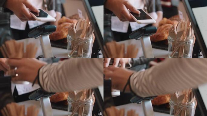 关闭使用智能手机移动汇款进行非接触式支付的客户在咖啡厅购买咖啡的妇女在餐厅享受服务