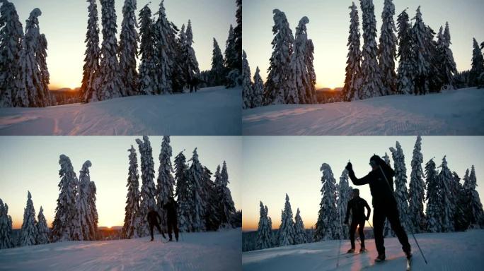 SLO MO两人在日落时的赛道上进行越野滑雪