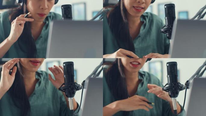 快乐亚洲女孩用耳机和麦克风在她的笔记本电脑上录制播客，并在她的房间里与观众交谈。