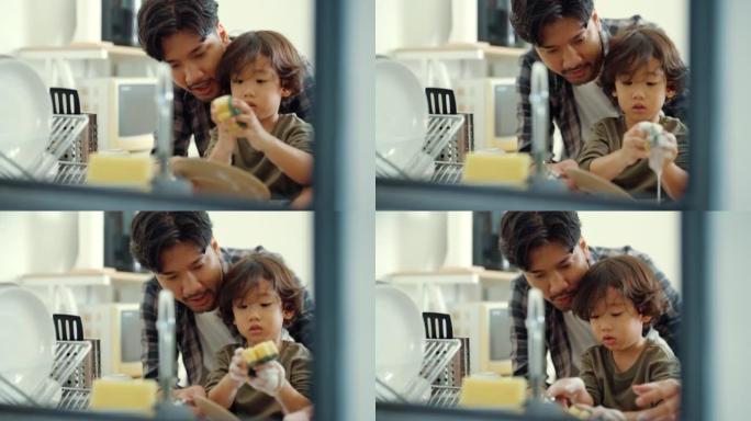 亲爱的儿子帮助亚洲父亲洗碗。
