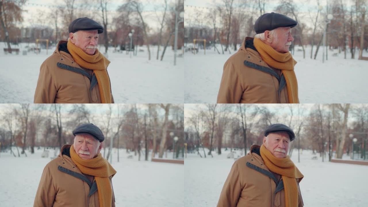 老人在冬季公园散步