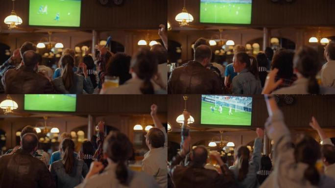 一群朋友在体育酒吧观看电视直播足球比赛。激动的球迷欢呼雀跃。年轻人庆祝球队进球并赢得世界杯足球赛。