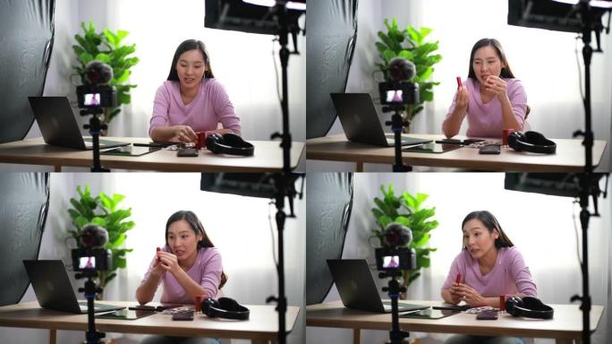 亚洲女人在相机上拍摄化妆教程。影响者