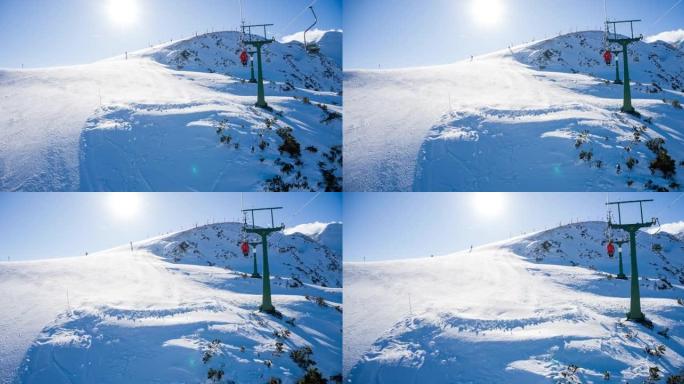在滑雪胜地乘坐单人缆车到白雪皑皑的山顶