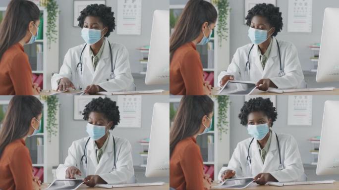 女医生或顾问戴口罩会见女病人讨论扫描