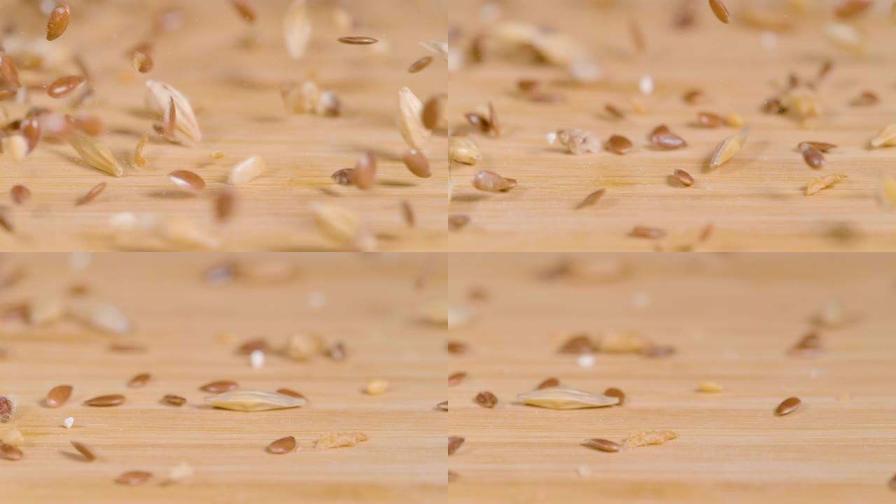 宏观: 小麦、芝麻和亚麻籽的混合物散落在桌子上。