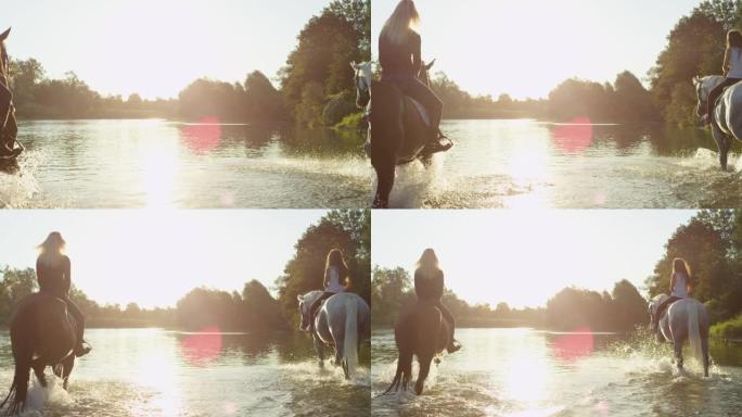 镜头耀斑: 日落时，两个朋友沿着浅滩骑马。