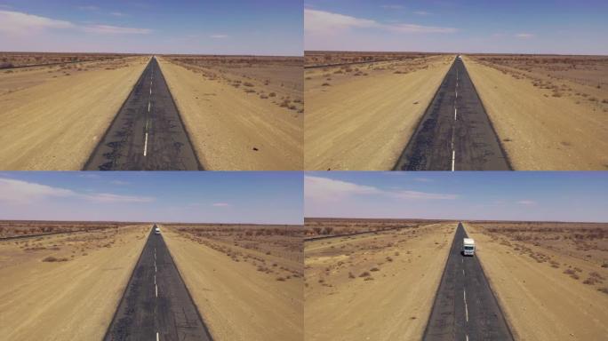 WS Truck driving on remote desert road, Namibia, A
