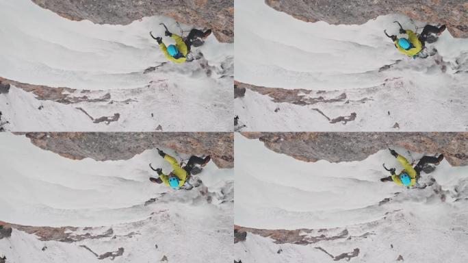在瀑布上爬冰极限运动征服雪山向上爬