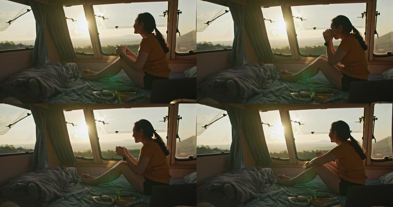 女性在度假期间在面包车里放松。年轻女子在露营车内旅行，欣赏山景